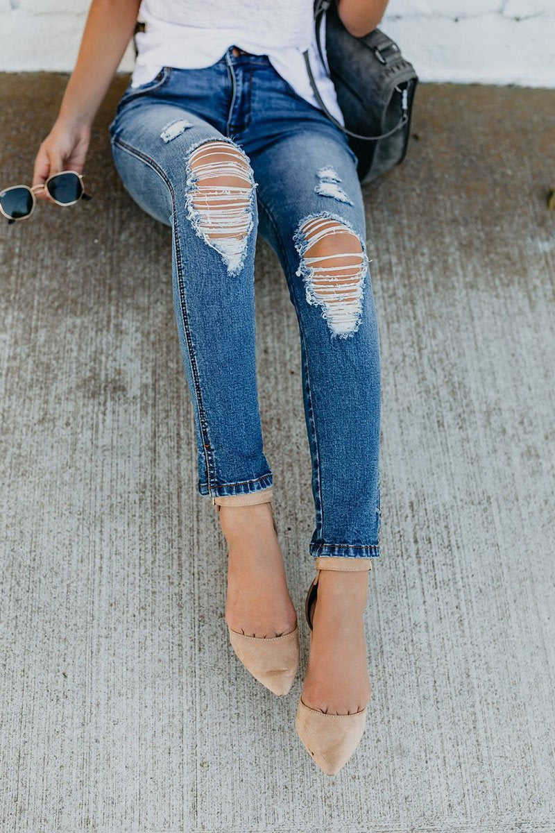 Vaqueros desgastados con tobillo